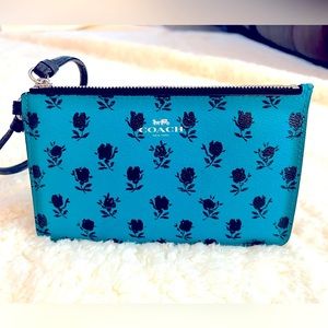 Coach wristlet. Never used. Teal color. Excellent condition.
